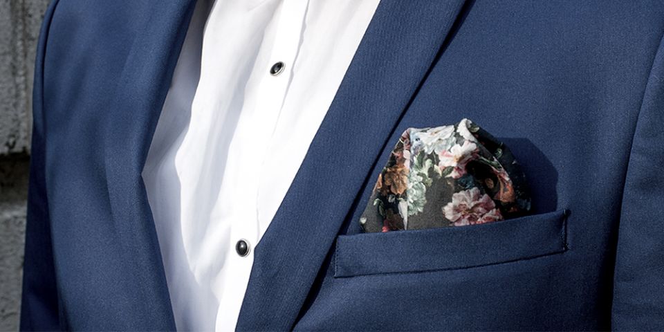 Man in a blue jacket with floral square Roses Man in a blue jacket with floral square Roses