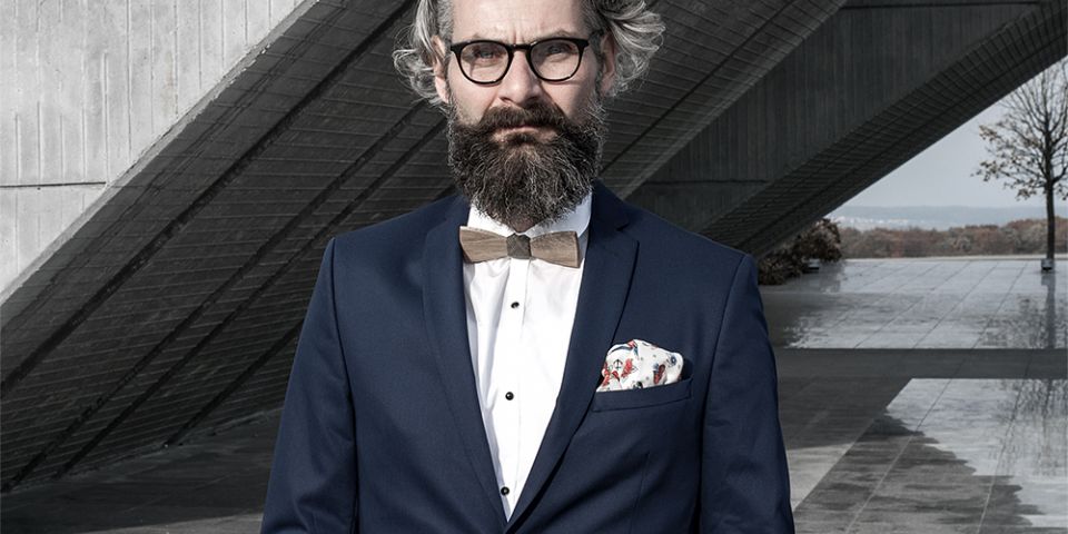 Man in a blue jacket with Hearts square and bow tie Lupus Man in a blue jacket with Hearts square and bow tie Lupus